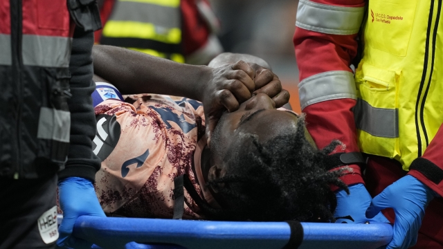 Torino's Duvan Zapata is carried off the pitch after being injured during the Serie A soccer match between Inter Milan and Torino at the San Siro Stadium, in Milan, Italy, Saturday, Oct. 5, 2024. (AP Photo/Antonio Calanni)