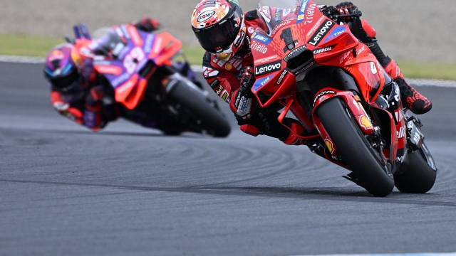 Ducati Lenovo Team rider Francesco Bagnaia of Italy (R) leads Prima Pramac Racing rider Jorge Martin of Spain (L) during the MotoGP Japanese Grand Prix at the Mobility Resort Motegi in Motegi, Tochigi prefecture on October 6, 2024. (Photo by Toshifumi KITAMURA / AFP)