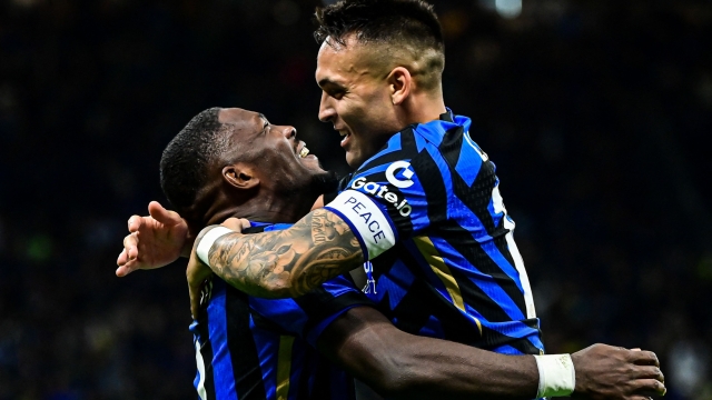 Inter Milan's French forward #09 Marcus Thuram celebrates  with Inter Milan's Argentine forward #10 Lautaro Martinez after scoring a goal during the Italian Serie A football match between Inter Milan and Torino at San Siro Stadium in Milan on October 5, 2024. (Photo by Piero CRUCIATTI / AFP)