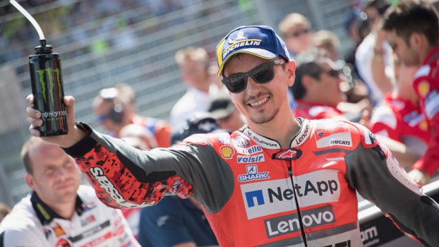 SPIELBERG, AUSTRIA - AUGUST 12:  Jorge Lorenzo of Spain and Ducati Team celebrates the victory under the podium at the end of the MotoGP race during the MotoGp of Austria - Race at Red Bull Ring on August 12, 2018 in Spielberg, Austria.  (Photo by Mirco Lazzari gp/Getty Images)