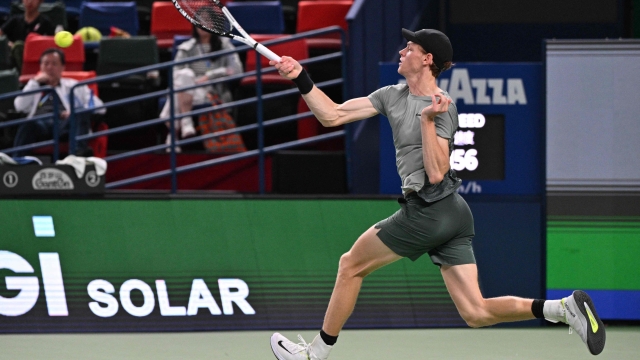 Italy's Jannik Sinner hits a return to Argentina's Tomas Martin Etcheverry during their men's singles match at the Shanghai Masters tennis tournament in Shanghai on October 6, 2024. (Photo by HECTOR RETAMAL / AFP)