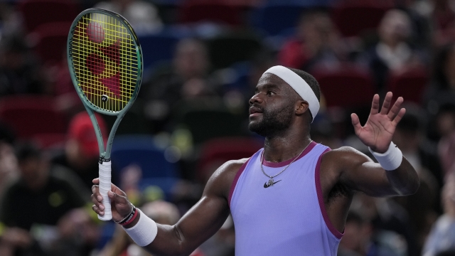 Frances Tiafoe of the United States waves to spectators after defeating Zhou Yi of China in the men's singles second round match in the Shanghai Masters tennis tournament at Qizhong Forest Sports City Tennis Center in Shanghai, China, Monday, Oct. 7, 2024. (AP Photo/Andy Wong)