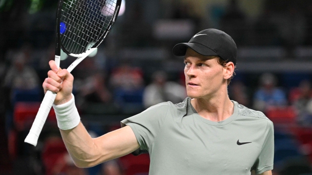 Italy's Jannik Sinner reacts to a point against Argentina's Tomas Martin Etcheverry during their men's singles match at the Shanghai Masters tennis tournament in Shanghai on October 6, 2024. (Photo by HECTOR RETAMAL / AFP)