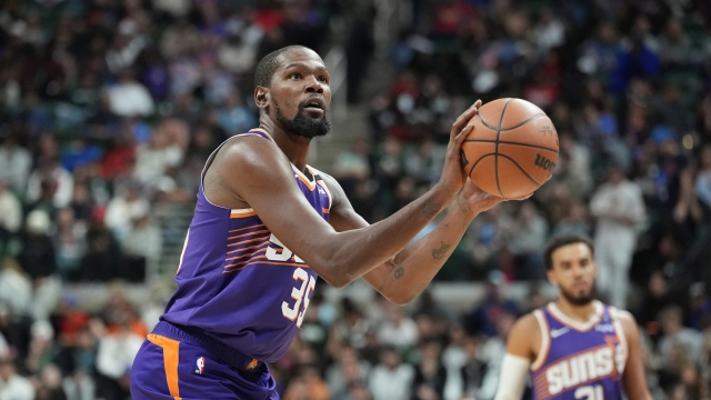 Phoenix Suns forward Kevin Durant shoots a free throw during the second half of an NBA preseason basketball game against the Detroit Pistons, Tuesday, Oct. 8, 2024, in East Lansing, Mich. (AP Photo/Carlos Osorio)