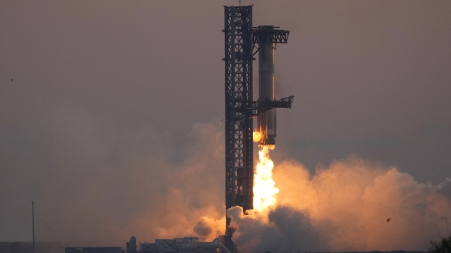 SpaceX's mega rocket booster returns to the launch pad to be captured during a test flight Sunday, Oct. 13, 2024, in Boca Chica,, Texas. (AP Photo/Eric Gay)