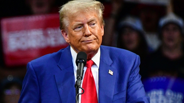 TOPSHOT - Former US President and Republican presidential candidate Donald Trump looks on during a campaign rally at Findlay Toyota Arena in Prescott Valley, Arizona, on October 13, 2024. (Photo by Caitlin O'Hara / AFP)