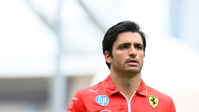 SINGAPORE, SINGAPORE - SEPTEMBER 19: Carlos Sainz of Spain and Ferrari walks in the Paddock during previews ahead of the F1 Grand Prix of Singapore at Marina Bay Street Circuit on September 19, 2024 in Singapore, Singapore. (Photo by Clive Mason/Getty Images)