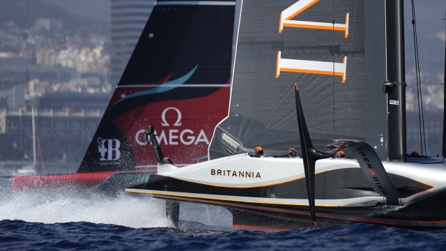 Ineos Britannia, right, and Emirates Team New Zealand race during the Louis Vuitton 37th America's Cup Day 4 race 6 in Barcelona, Spain, Wednesday, Oct. 16, 2024. (AP Photo/Bernat Armangue)