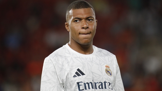 FILE - Real Madrid's Kylian Mbappe looks on before the start of a Spanish La Liga soccer match between Mallorca and Real Madrid at the Son Moix Stadium in Palma de Mallorca, Spain, Sunday, Aug. 18, 2024. (AP Photo/Francisco Ubilla, File)