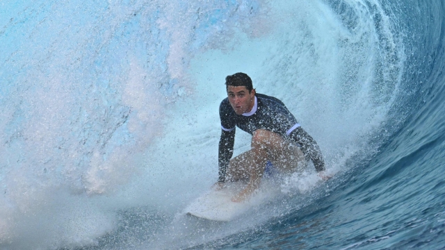 Italy's Leonardo Fioravanti takes part in a surfing training session in Teahupo'o, on the French Polynesian Island of Tahiti, on July 23, 2024, ahead of the Paris 2024 Olympic Games. (Photo by Jerome BROUILLET / AFP)