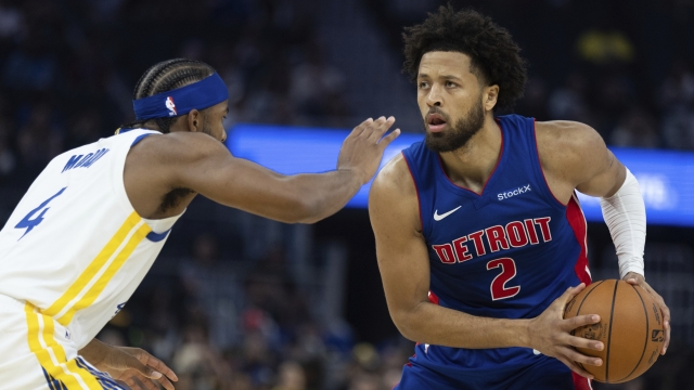 Golden State Warriors guard Moses Moody (4) defends against Detroit Pistons guard Cade Cunningham (2) during the first half of a preseason NBA basketball game Sunday, Oct. 13, 2024, in San Francisco. (AP Photo/Benjamin Fanjoy)