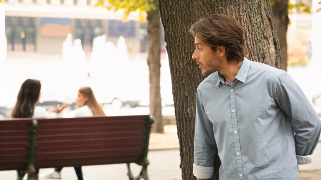 Suspicious Man Spying On Girls Stalking Them While They Talking Sitting In Park