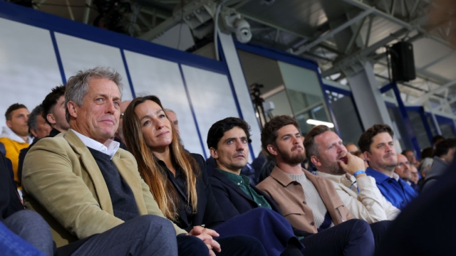 COMO, ITALY - OCTOBER 19: Hugh Grant, Anna Eberstein and Andrew Garfield attend the match between Como 1907 and Parma at Giuseppe Sinigaglia Stadium on October 19, 2024 in Como, Italy. (Photo by Jacopo M. Raule/Getty Images for Como 1907)