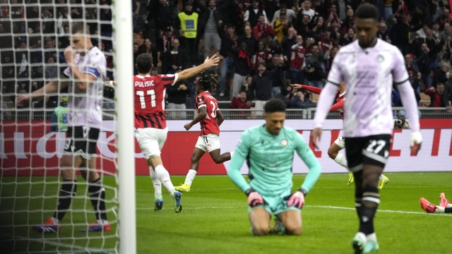 AC Milan's Samuel Chukwueze, background centre, celebrates after scoring the opening goal during the Serie A soccer match between AC Milan and Udinese at the San Siro Stadium, in Milan, Italy, Saturday, Oct. 19, 2024. (AP Photo/Antonio Calanni)