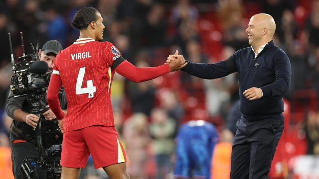 epa11671739 Virgil van Dijk of Liverpool and Liverpool manager Arne Slot (R) shake hands after the English Premier League match between Liverpool FC and Chelsea FC in Liverpool, Britain, 20 October 2024.  EPA/ADAM VAUGHAN EDITORIAL USE ONLY. No use with unauthorized audio, video, data, fixture lists, club/league logos, 'live' services or NFTs. Online in-match use limited to 120 images, no video emulation. No use in betting, games or single club/league/player publications.