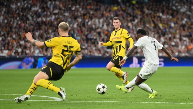 MADRID, SPAIN - OCTOBER 22: Vinicius Junior of Real Madrid scores his team's fourth goal during the UEFA Champions League 2024/25 League Phase MD3 match between Real Madrid C.F. and Borussia Dortmund at Estadio Santiago Bernabeu on October 22, 2024 in Madrid, Spain. (Photo by Denis Doyle/Getty Images)