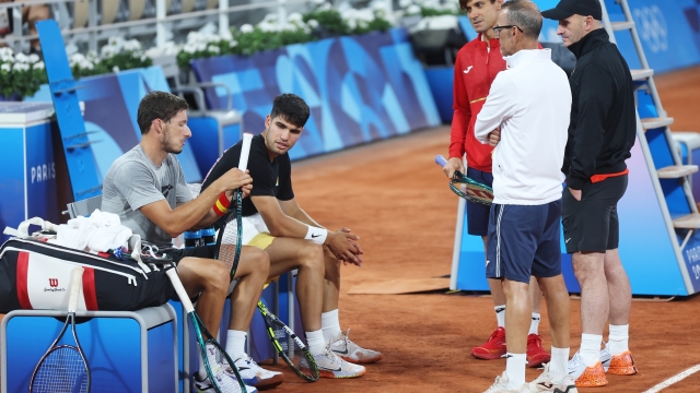 PARIS, FRANCE - JULY 23: Pablo Carreno Busta and Carlos Alcaraz of Team Spain interact with Team Spain Tennis coach David Ferrer (3rd R) and members of their coaching team during a tennis training session at Roland-Garros during a tennis training session at Roland-Garros ahead of the Paris Olympic Games on July 23, 2024 in Paris, France. (Photo by Matthew Stockman/Getty Images)