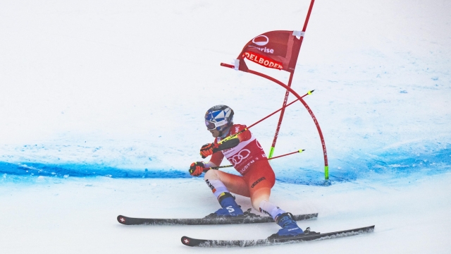 epa11060816 Marco Odermatt of Switzerland in action during the second run of the Men's Giant Slalom race at the  FIS Alpine Skiing World Cup in Adelboden, Switzerland, 06 January 2024.  EPA/JEAN-CHRISTOPHE BOTT