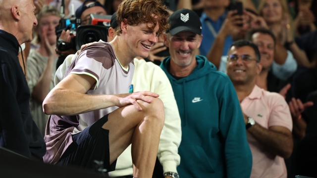 MELBOURNE, AUSTRALIA - JANUARY 28: Jannik Sinner of Italy celebrates winning with coach Darren Cahill and his team after their Men's Singles Final match against Daniil Medvedev during the 2024 Australian Open at Melbourne Park on January 28, 2024 in Melbourne, Australia. (Photo by Daniel Pockett/Getty Images)