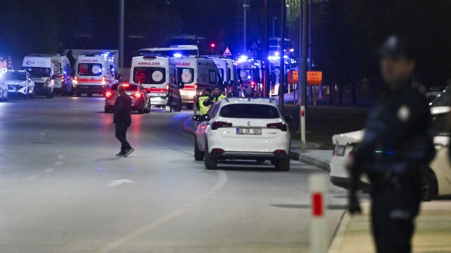 Ambulances wait in line outside of Turkish Aerospace Industries Inc. at the outskirts of Ankara, Turkey, Wednesday, Oct. 23, 2024. (AP Photo/Mert Gokhan Koc)