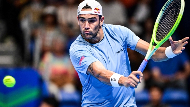 Italy's Matteo Berrettini hits a return to Netherlands' Botic van De Zandschulp during their men's singles match at the Japan Open tennis tournament at Ariake Coliseum in Tokyo on September 25, 2024. (Photo by Yuichi YAMAZAKI / AFP)