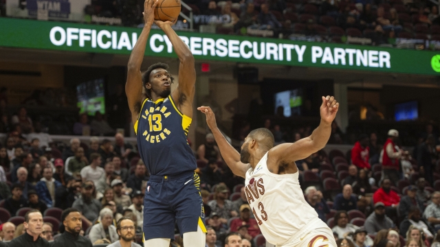 Indiana Pacers' James Wiseman (13) shoots over Cleveland Cavaliers' Tristan Thompson (13) during the second half of a preseason NBA basketball game in Cleveland, Thursday, Oct. 10, 2024. (AP Photo/Phil Long)