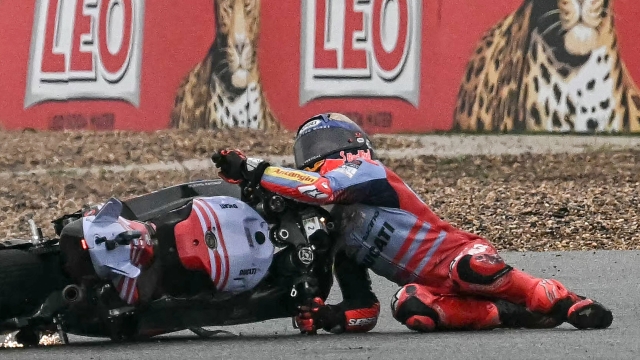 Gresini Racing MotoGP's Spanish rider Marc Marquez crashes during the MotoGP Thailand Grand Prix at the Buriram International Circuit in Buriram on October 27, 2024. (Photo by Lillian SUWANRUMPHA / AFP)