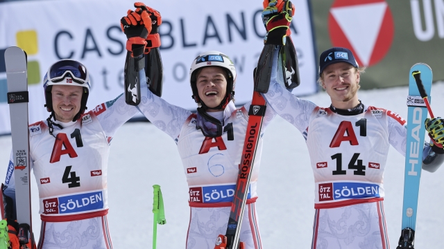 Norway's Alexander Steen Olsen, center, winner of an alpine ski, men's World Cup giant slalom, celebrates with second-placed Norway's Henrik Kristoffersen, left, and third-placed Norway's Atle Lie McGrath, in Soelden, Austria, Sunday, Oct. 27, 2024. (AP Photo/Marco Trovati)