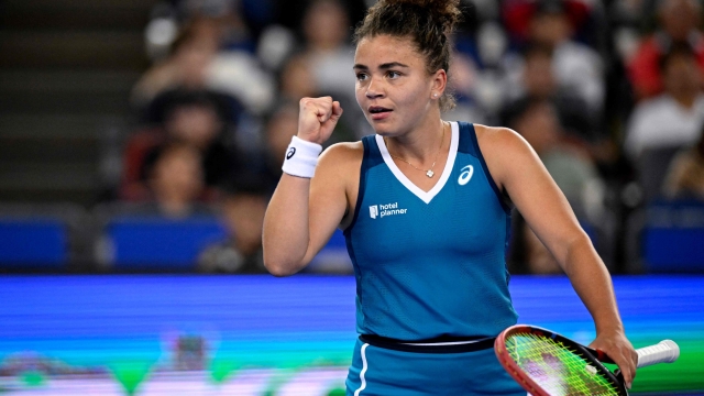 Italy's Jasmine Paolini reacts during women's singles quater-final match against China's Zheng Qinwen  at the Wuhan Open tennis tournament in Wuhan, China's Hubei province on October 11, 2024. (Photo by WANG Zhao / AFP)