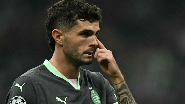 AC Milan's American forward #11 Christian Pulisic reacts during the Champions League football match between AC Milan and Club Brugge at the San Siro stadium in Milan on October 22, 2024. (Photo by Gabriel BOUYS / AFP)