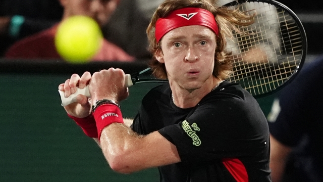 Russia's Andrey Rublev eyes the ball as he plays against Argentina's Francisco Cerundolo during their men's singles match on day two of the Paris ATP Masters 1000 tennis tournament at the Accor Arena - Palais Omnisports de Paris-Bercy - in Paris on October 29, 2024. (Photo by Dimitar DILKOFF / AFP)