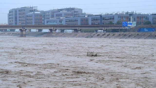 A picture taken on October 30, 2024 shows the Turia river following floods in Valencia, eastern Spain. Floods triggered by torrential rains in Spain's eastern Valencia region has left 51 people dead, rescue services said on October 30. (Photo by Jose Jordan / AFP)