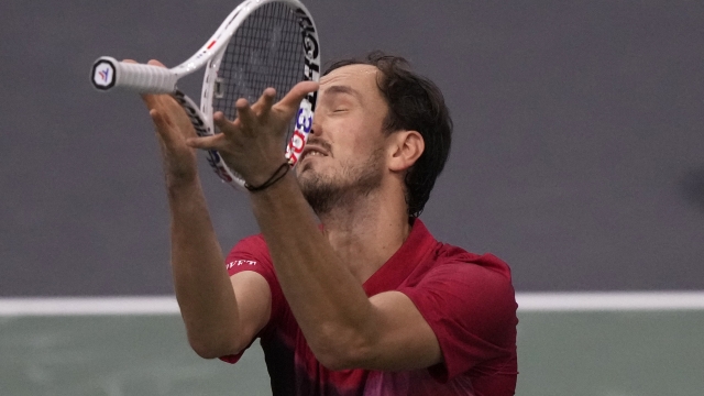 Russia's Daniil Medvedev throws his racket as he plays Alexei Popyrin, of Australia, during their second round match of the Paris Masters tennis tournament, Wednesday, Oct. 30, 2024 in Paris. (AP Photo/Michel Euler)