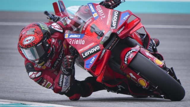 Italian rider Francesco Bagnaia of Ducati Lenovo Team steers his motorcycle during the free practices at Sepang International Circuit ahead of MotoGP race in Sepang, outskirts of Kuala Lumpur, Friday, Nov. 1, 2024. (AP Photo/Vincent Thian)