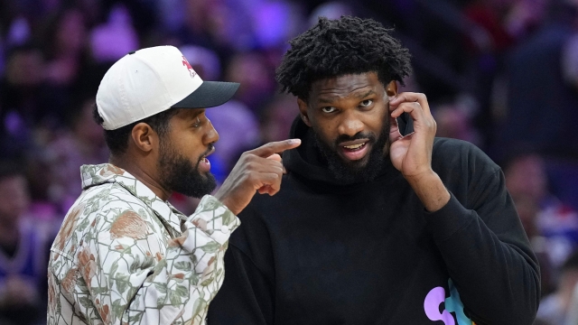 PHILADELPHIA, PENNSYLVANIA - NOVEMBER 2: Paul George #8 of the Philadelphia 76ers talks to Joel Embiid #21 during a timeout in the game against the Memphis Grizzlies in the first half at the Wells Fargo Center on November 2, 2024 in Philadelphia, Pennsylvania. NOTE TO USER: User expressly acknowledges and agrees that, by downloading and/or using this photograph, user is consenting to the terms and conditions of the Getty Images License Agreement.   Mitchell Leff/Getty Images/AFP (Photo by Mitchell Leff / GETTY IMAGES NORTH AMERICA / Getty Images via AFP)