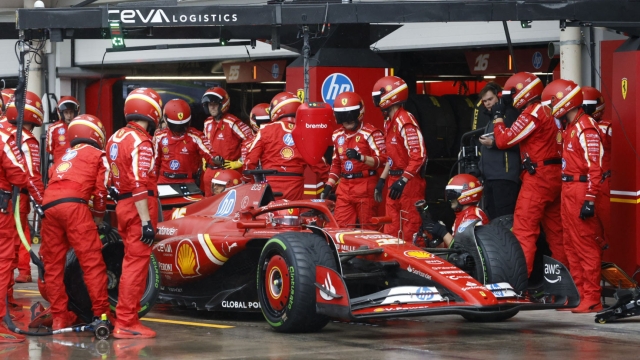 Ferrari driver Charles Leclerc of Monaco, changes tires at his box during the Brazilian Formula One Grand Prix at the Interlagos race track in Sao Paulo, Brazil, Sunday, Nov.3, 2022. (Sebastian Moreira/Pool via AP)