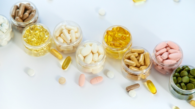 Supplements and vitamins on a white background. Selective focus. Medicine.