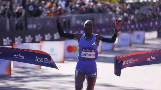 epa11699354 Kenya's Sheila Chepkirui crosses the finish line to win first place in the women's pro open race during the 2024 New York City Marathon in New York, New York, USA, 03 November 2024.  EPA/SARAH YENESEL