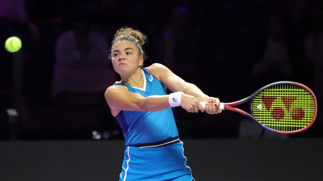 Italy's Jasmine Paolini returns the ball to Belarus' Aryna Sabalenka during their women's singles tennis match at the WTA Finals Championship in Riyadh on November 4, 2024. (Photo by Fayez NURELDINE / AFP)