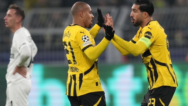 Dortmund's Donyell Malen, left, celebrates with Dortmund's Emre Can after scoring his sides first goal during to the Champions League opening phase soccer match between Borussia Dortmund and Sturm Graz in Dortmund, Germany, Tuesday, Nov. 5, 2024. (AP Photo/Martin Meissner)