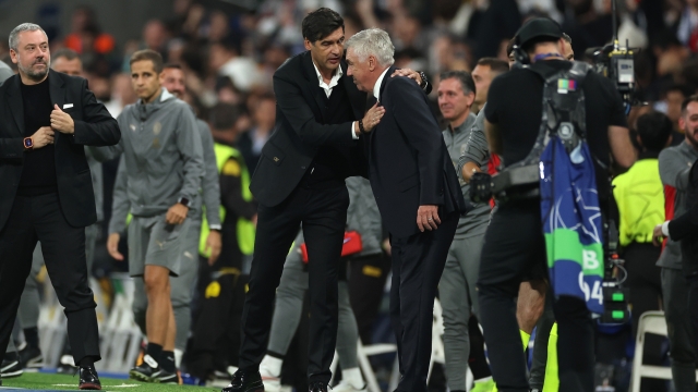 MADRID, SPAIN - NOVEMBER 05: Paulo Fonseca, Head Coach of AC Milan, and Carlo Ancelotti, Head Coach of Real Madrid, embrace at full-time following the UEFA Champions League 2024/25 League Phase MD4 match between Real Madrid C.F. and AC Milan at Estadio Santiago Bernabeu on November 05, 2024 in Madrid, Spain. (Photo by Florencia Tan Jun/Getty Images)