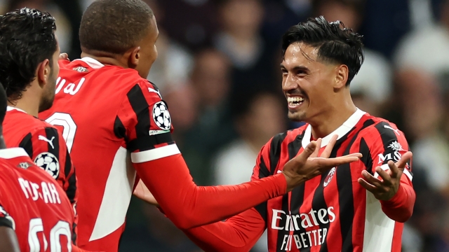 MADRID, SPAIN - NOVEMBER 05: Tijjani Reijnders of AC Milan celebrates with teammates after scoring his team's third goal during the UEFA Champions League 2024/25 League Phase MD4 match between Real Madrid C.F. and AC Milan at Estadio Santiago Bernabeu on November 05, 2024 in Madrid, Spain. (Photo by Florencia Tan Jun/Getty Images)