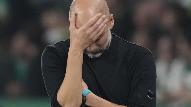 Manchester City's head coach Pep Guardiola reacts during the UEFA Champions League opening phase soccer match between Sporting and Manchester City in Lisbon, Portugal, Tuesday, Nov. 5, 2024. (AP Photo/Armando Franca)