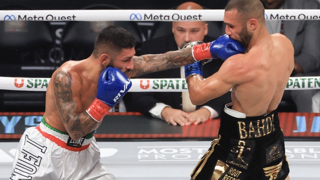 ARLINGTON, TEXAS - NOVEMBER 15: Armando Casamonica (L) punches Lucas Bahdi during their lightweight bout at AT&T Stadium on November 15, 2024 in Arlington, Texas.   Christian Petersen/Getty Images/AFP (Photo by Christian Petersen / GETTY IMAGES NORTH AMERICA / Getty Images via AFP)