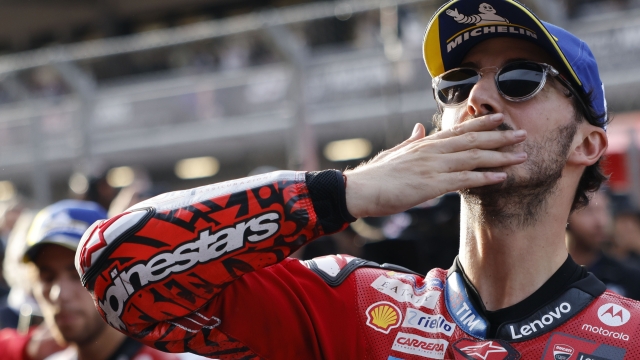 Italian rider Francesco Bagnaia of the Ducati Lenovo Team celebrates after winning the MotoGP sprint race ahead of Sunday's Grand Prix of Barcelona at the Catalunya racetrack in Montmelo, just outside of Barcelona, Spain, Saturday, Nov. 16, 2024. (AP Photo/Joan Monfort)