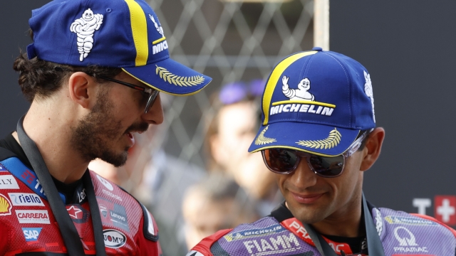 Race winner Italian rider Francesco Bagnaia of the Ducati Lenovo Team, left, speaks with third placed Spain's rider Jorge Martin of the Prima Pramac Racing after the MotoGP sprint race ahead of Sunday's Grand Prix of Barcelona at the Catalunya racetrack in Montmelo, just outside of Barcelona, Spain, Saturday, Nov. 16, 2024. (AP Photo/Joan Monfort)