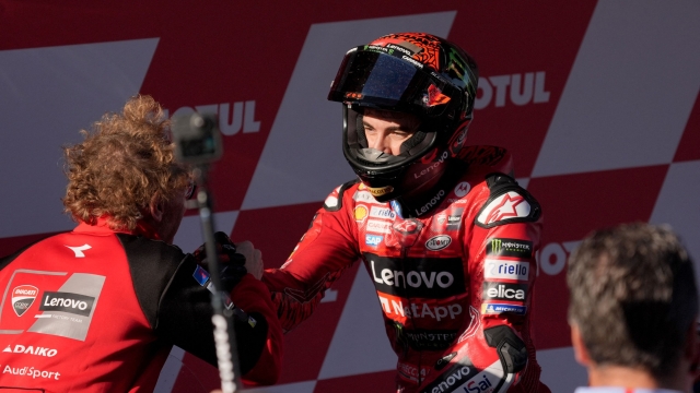 Ducati Italian rider Francesco Bagnaia celebrates his second place in the general ranking after the MotoGP Solidarity Grand Prix of Barcelona at the Circuit de Catalunya on November 17, 2024 in Montmelo on the outskirts of Barcelona. Jorge Martin won the MotoGP world title after taking a 24-point lead into the final weekend of the season in Barcelona. (Photo by Manaure Quintero / AFP)