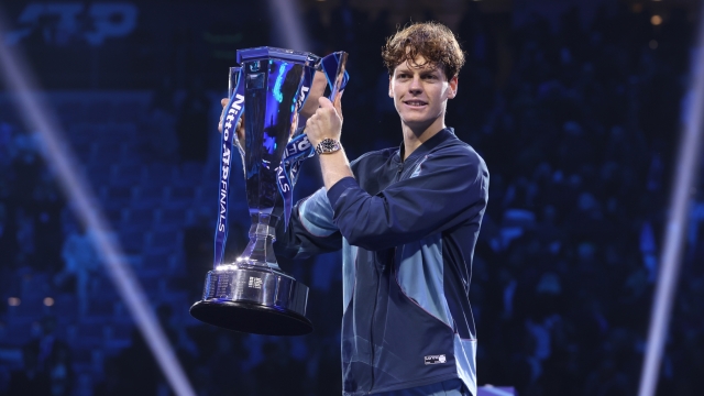 TURIN, ITALY - NOVEMBER 17: Jannik Sinner of Italy poses for a photo with the trophy after his victory against Taylor Fritz of United States during the Men's Singles final match on day eight of the Nitto ATP finals 2024 at Inalpi Arena on November 17, 2024 in Turin, Italy.  (Photo by Clive Brunskill/Getty Images)