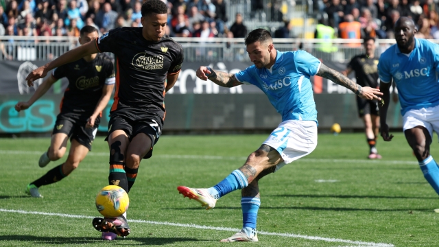VENICE, ITALY - MARCH 16: Matteo Politano of Napoli shoots as Joel Schingtienne of Venezia defends during the Serie A match between Venezia and Napoli at Stadio Pier Luigi Penzo on March 16, 2025 in Venice, Italy. (Photo by Timothy Rogers/Getty Images)