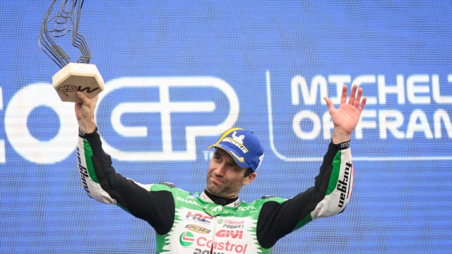 LCR Honda team's French MotoGP rider Johann Zarco celebrates on the podium after winning the France Moto GP race at the Le Mans Circuit on May 11, 2025. (Photo by Loic VENANCE / AFP)